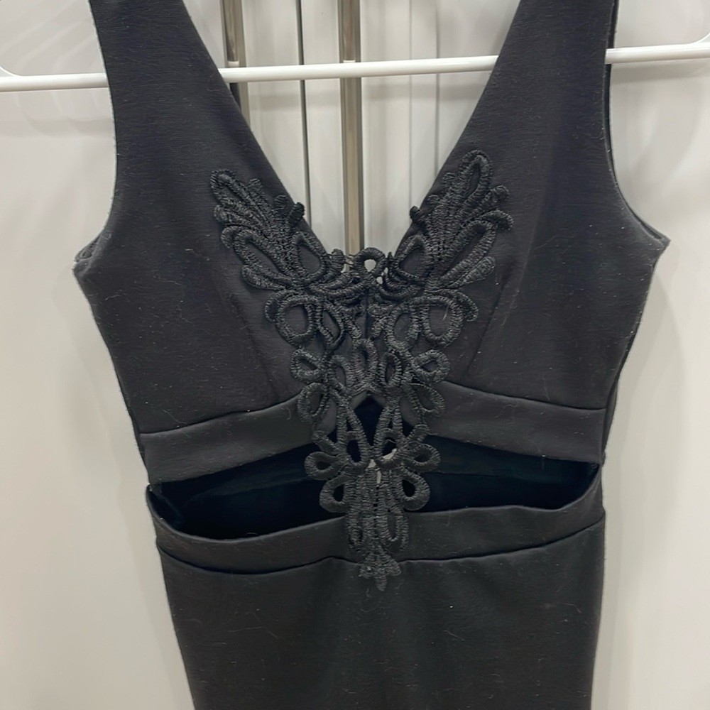 Black TOBI dress with open-detail in midsection. Super flattering! Low V-back.